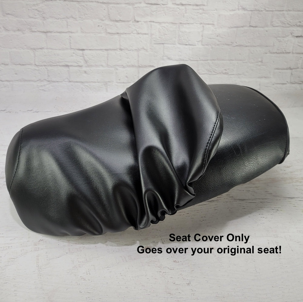 Black Yamaha Vino 125 seat cover shown partially removed to demonstrate that the cover fits over the original scooter seat, handmade by Cheeky Seats.