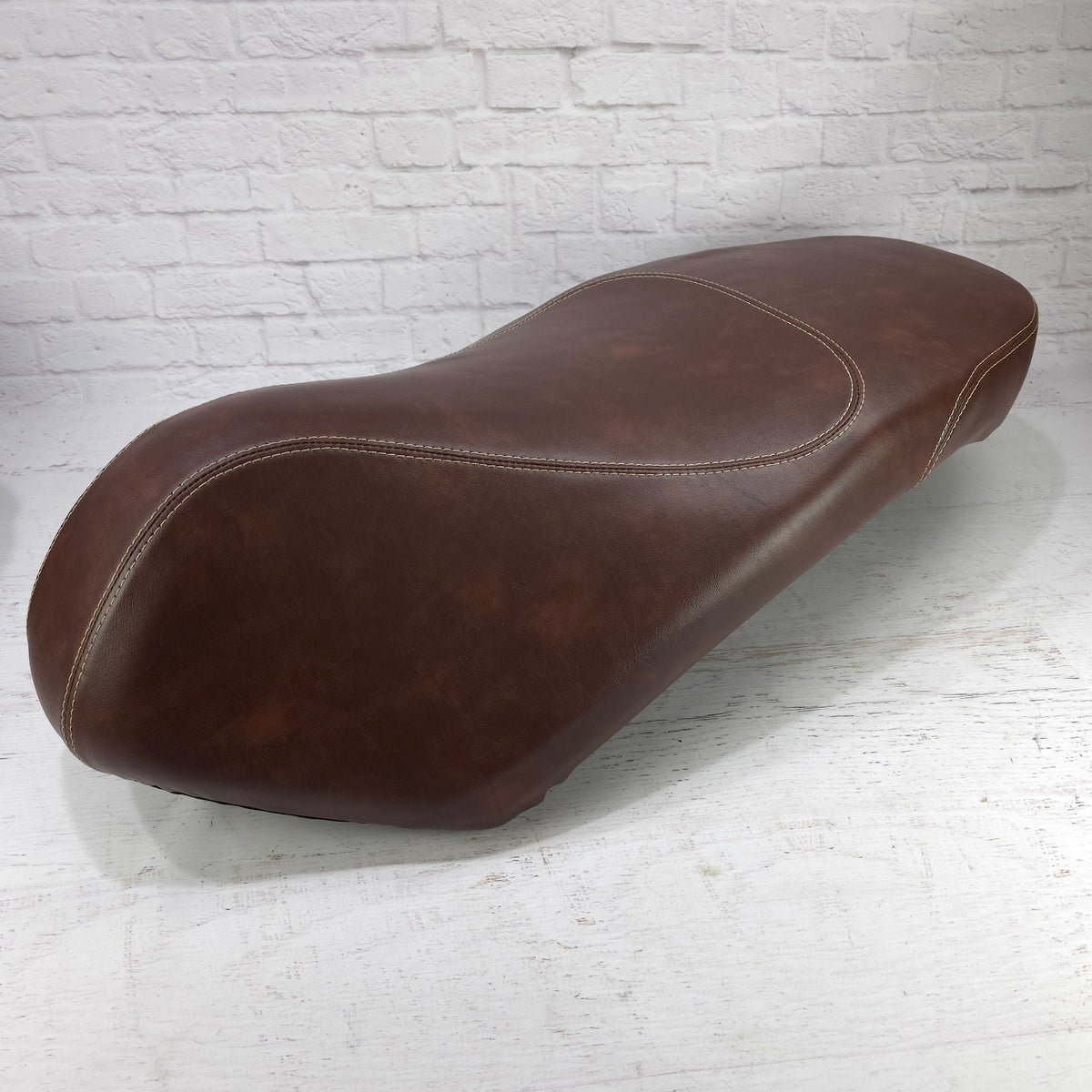 Piaggio Liberty whiskey brown seat cover installed, handmade by Cheeky Seats