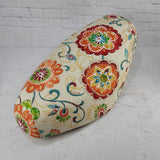 Ecru floral Cheeky Seats cover for a Genuine Buddy seat with orange, green and teal flowers