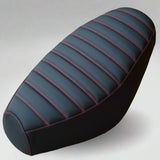 Black padded tuck-and-roll Cheeky Seats cover for a Genuine Buddy with contrasting red stitching
