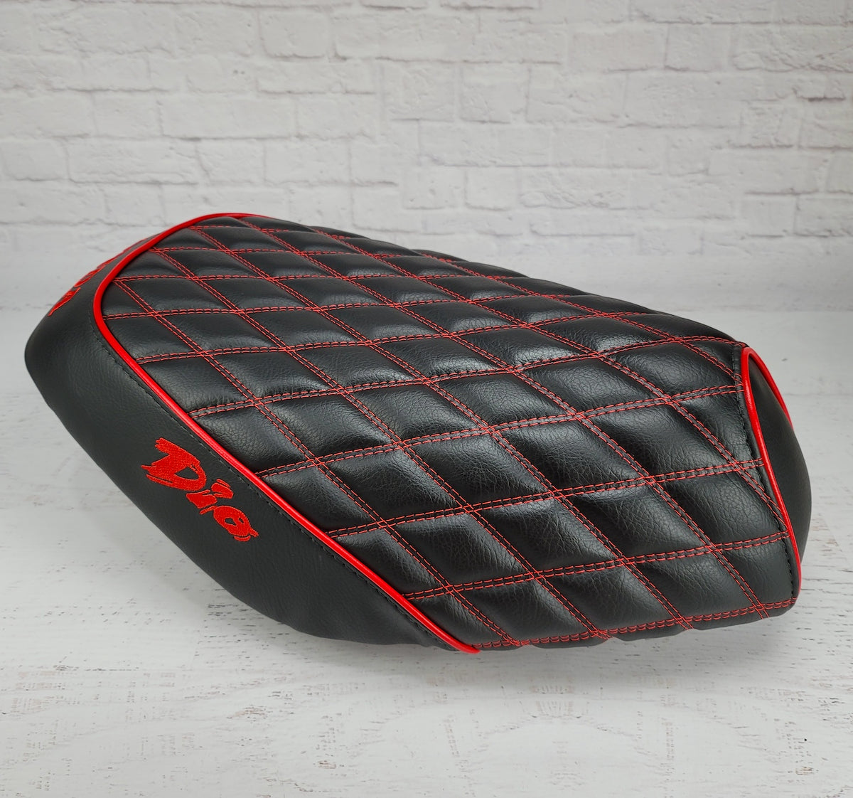 Honda Dio 1 & 2 Diamond Seat Cover with Red Piping,  and embroidered Dio logos, handmade by  Cheeky Seats