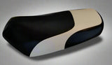 Waterproof Black and White seat cover for 2002–2019 Yamaha Zuma 50 scooters, with sweeping white accent panels, handmade by Cheeky Seats.