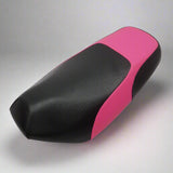 Pink and Black Yamaha Zuma 50 seat cover with a textured black center and bright pink side and rear panels, handmade by Cheeky Seats.