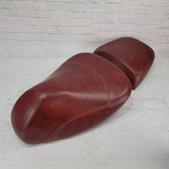 Vespa GTV split saddle seat cover in distressed oxblood with french seams